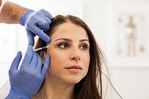 Will Botox Make My Crow'S Feet Disappear? 1 Woman Receiving Botox Injection For Crow’s Feet Treatment