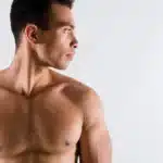 Tanned Guy Looking Aside Working Out