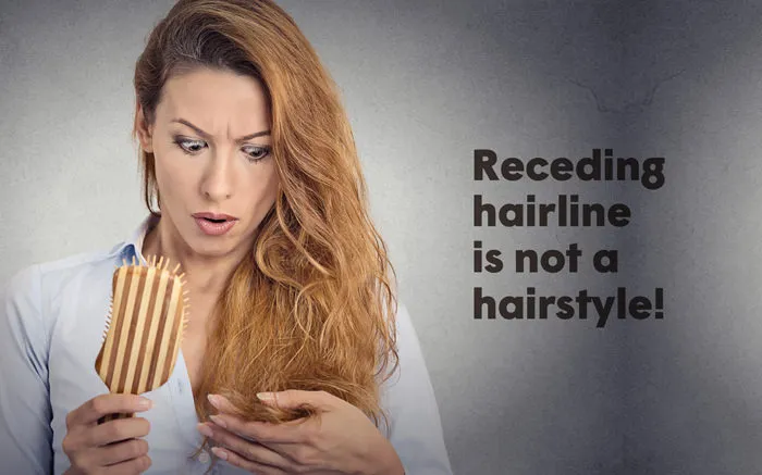 woman surprised of her hair loss